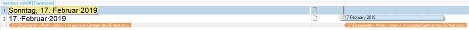 Trados Studio screenshot showing a recognized German date 'Sonntag, 17. Februar 2019' in the source column and '17 February 2019' in the target column.