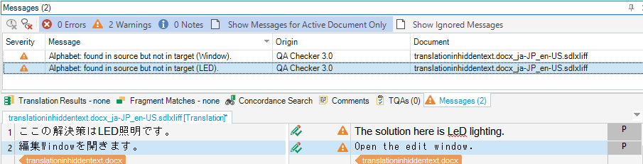 Trados Studio screenshot showing 2 warnings in Messages panel, 'Alphabet: found in source but not in target (Window)' and 'Alphabet: found in source but not in target (LED)', indicating potential translation issues.
