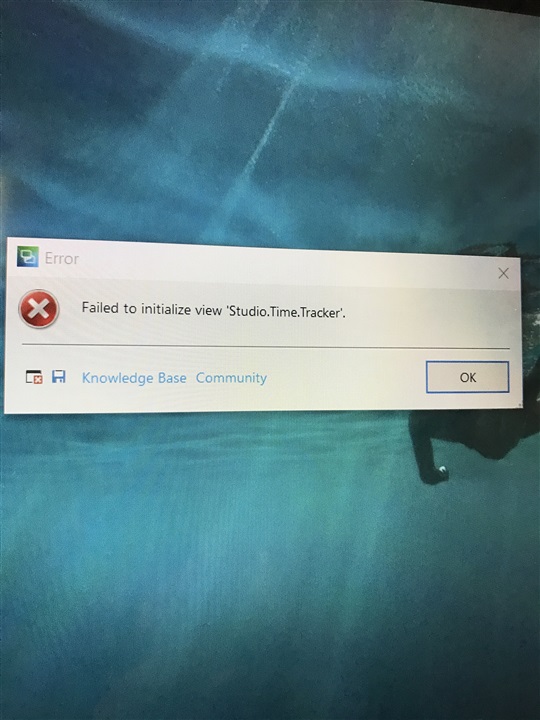 Error message window on a computer screen displaying 'Failed to initialize view 'Studio.Time.Tracker' with an 'OK' button and links to 'Knowledge Base' and 'Community'.